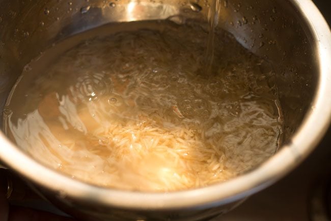 rinsing basmati rice in water. 