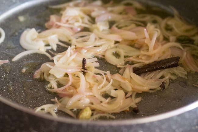 frying onions in the pot. 