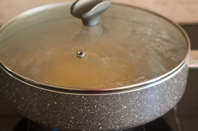 cooking the rice in a covered pot. 