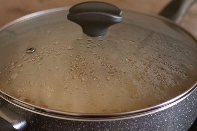 cooking the rice in a covered pot. 