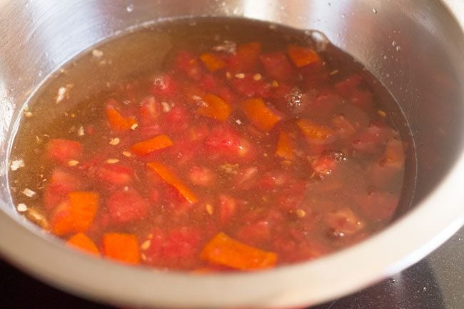 crushed tomatoes added to tamarind pulp