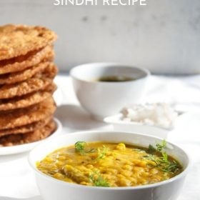 dal pakwan served in a bowl and plate with a small bowl of chutney and chopped onions kept at the back and text layovers.