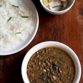 amritsari dal served with rice and a side of salad.
