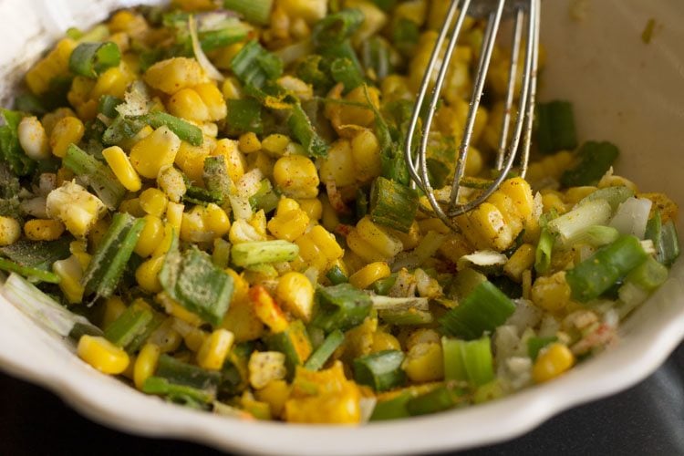 mixing corn with spices