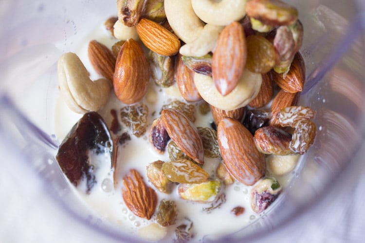 rinsed dry fruits, chopped figs, dates and milk in a blender jar
