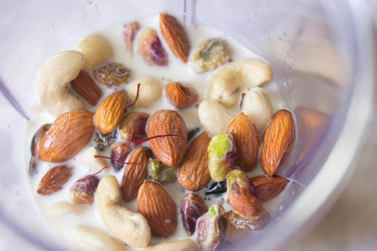 rinsed dry fruits, chopped figs, dates, milk and saffron in a blender jar