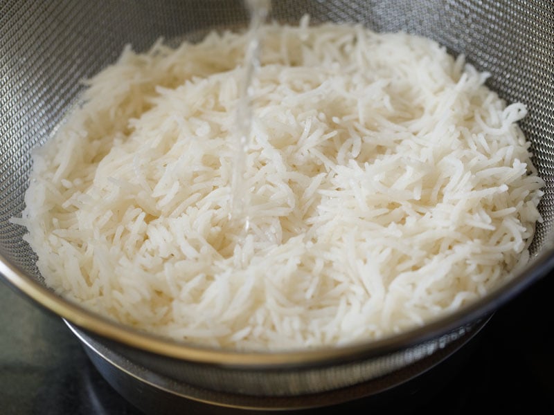 rinsing rice in the colander