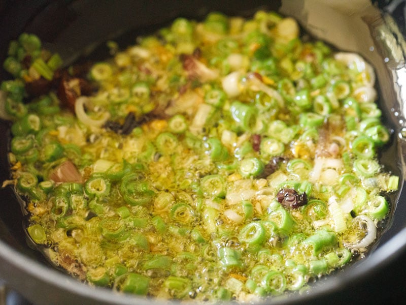 beans being stir-fried