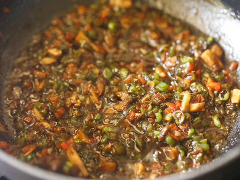 fried veggies mixed with soy sauce and seasonings