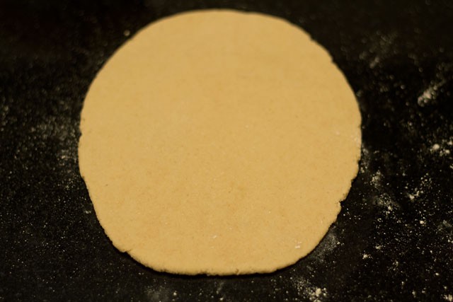 rolling out the first half of the bread dough.