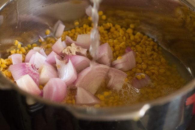 cooking tuvar dal in a pressure cooker along with onions