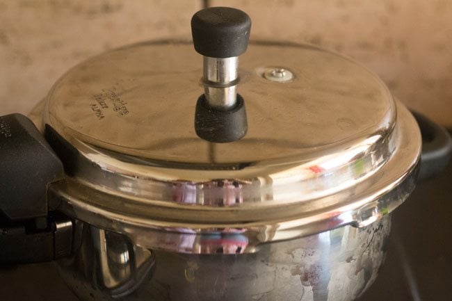 kathirikai sambar in a pressure cooker with closed lid