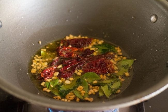 frying red chilies and curry leaves 