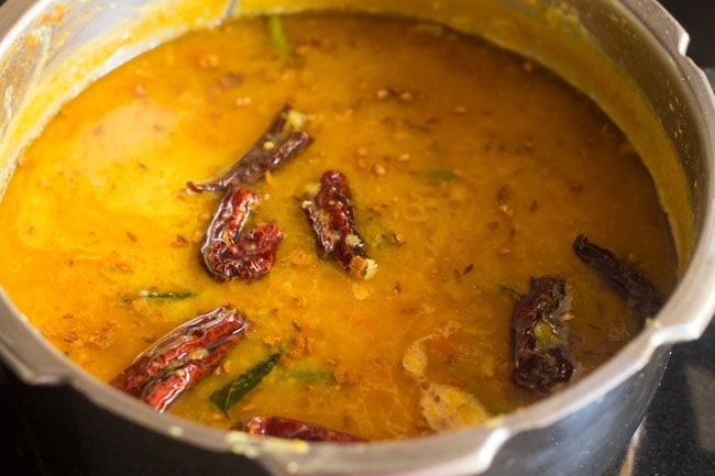 stirring tempering into dal