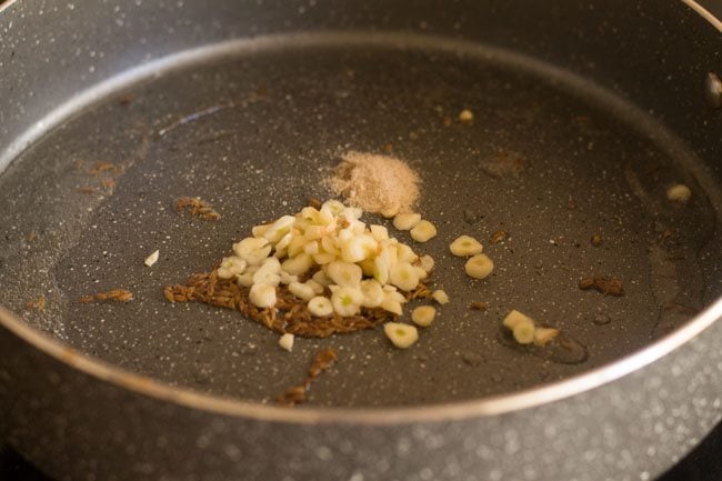 adding garlic