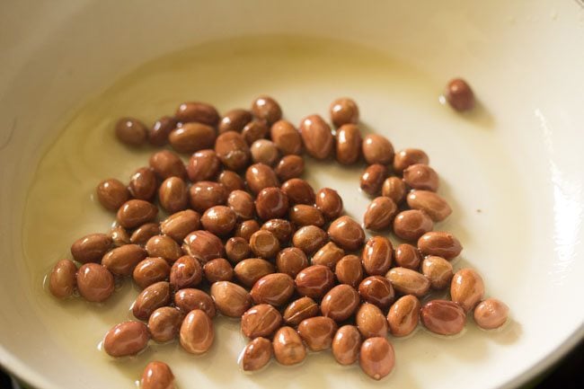 frying peanuts in pan