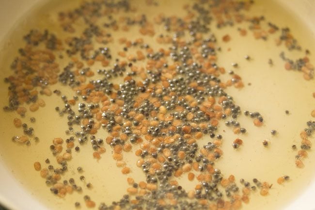 frying urad dal in the pan