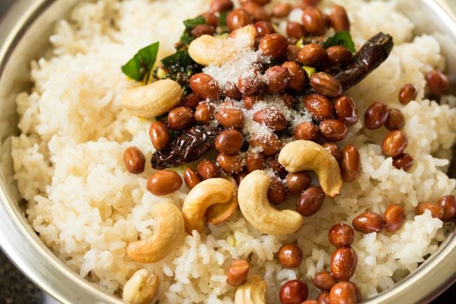 salt added to cooked rice in bowl