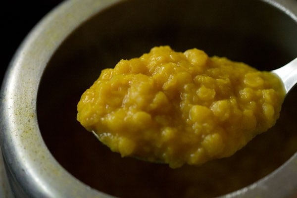 pressure cooked arhar dal in a spoon