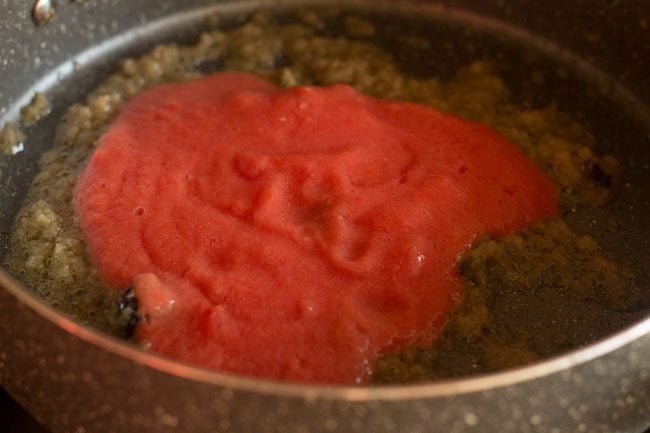 tomato puree added to pan