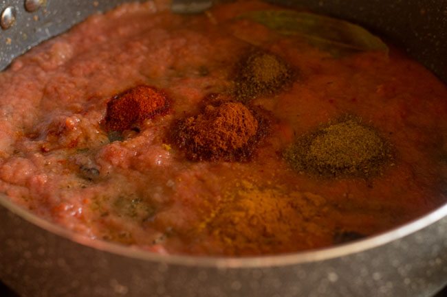 spices added to masala mixture in the pan