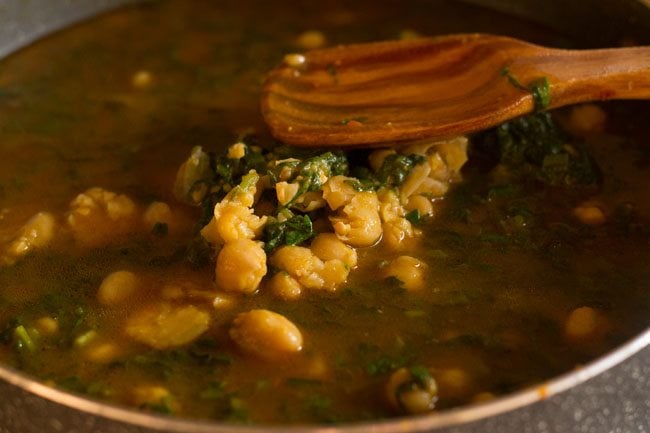 mashing chickpeas with a spoon