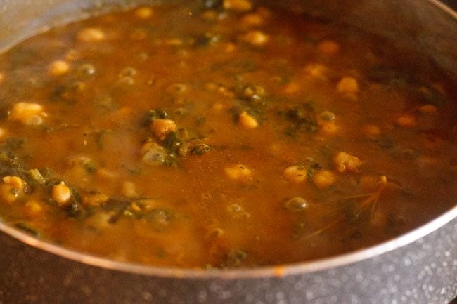 palak chole gravy in a pan