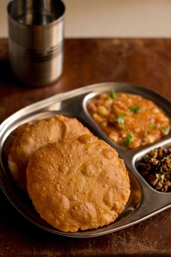 singhara ke atta ki poori served with potato curry in a plate