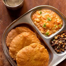 singhara ke atta ki poori served with potato curry in a plate