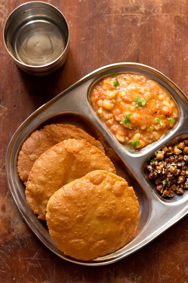 singhara ke atta ki poori served with potato curry in a plate