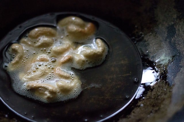 frying cashews in hot oil. 