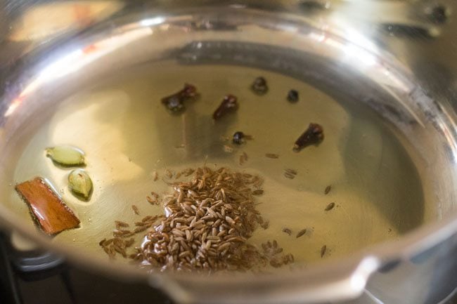 whole spices added in the hot ghee. 