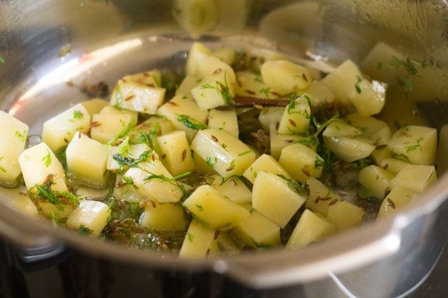 sautéing potato mixture. 