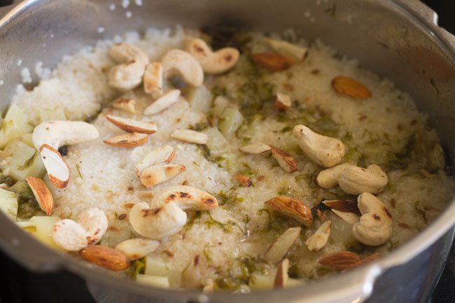 sama ke chawal ka pulao garnished with roasted cashews, almonds and coriander leaves. 