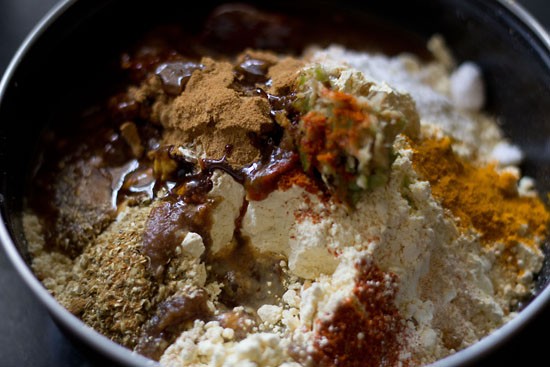 powdered jaggery and tamarind pulp added to the bowl for patra recipe. 