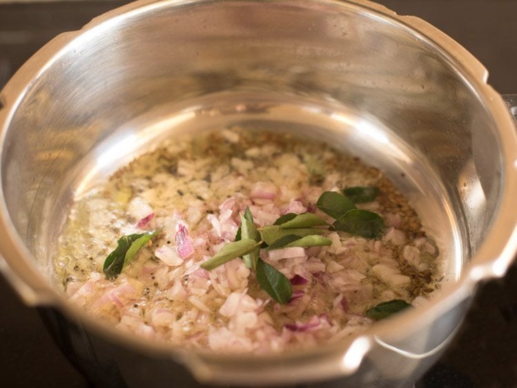 chopped onions and curry leaves added