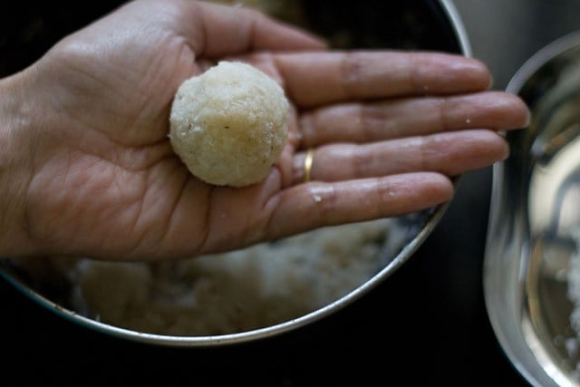 nariyal ladoo on a palm