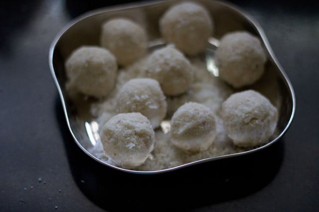 neatly shaped nariyal ke laddu on a plate