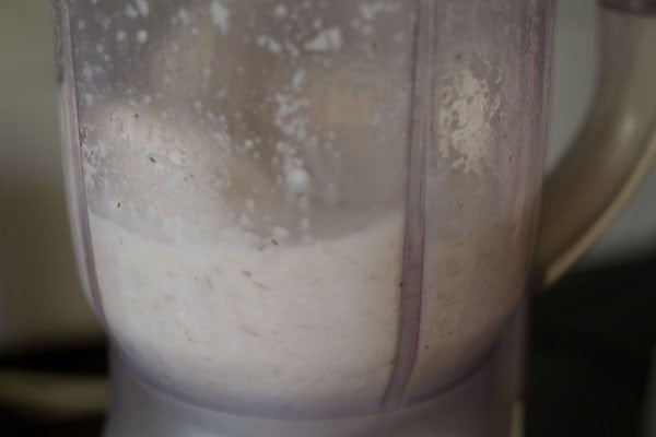 blending grated coconut with water.