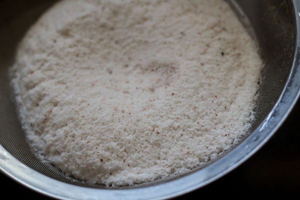 blended coconut added in a bowl lined with a muslin cloth. 