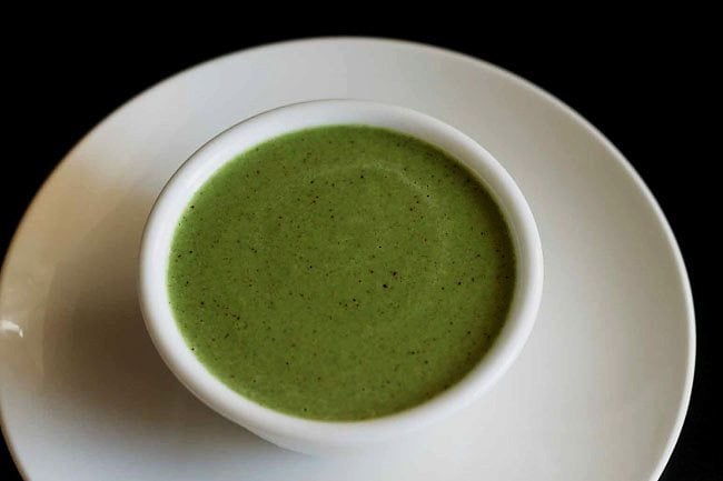 curry leaves chutney added to a serving bowl. 