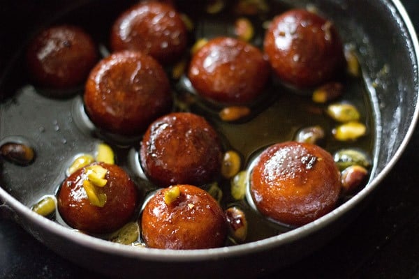 gulab jamun placed in sugar syrup.