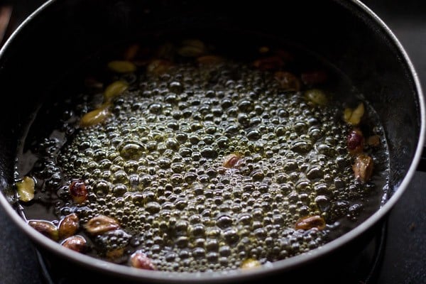 chopped pistachios added to simmering sugar syrup.