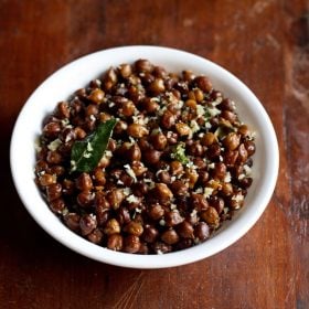 top shot of Black Channa Sundal or Kondakadalai Sundal served in a white bowl on a wooden table.