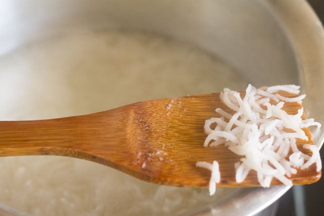 cooked rice in a wooden spoon