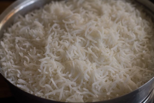 soft fluffy rice in the colander with lid removed