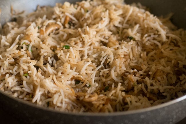 stir fry mushroom fried rice for 2 to 3 minutes