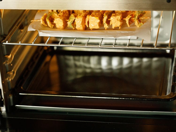 paneer tikka being grilled in the oven