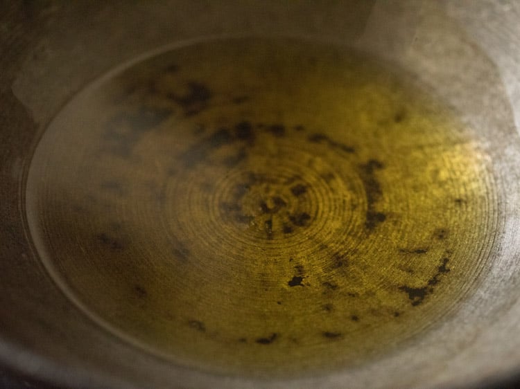 melted ghee in the kadai for rava kesari recipe. 