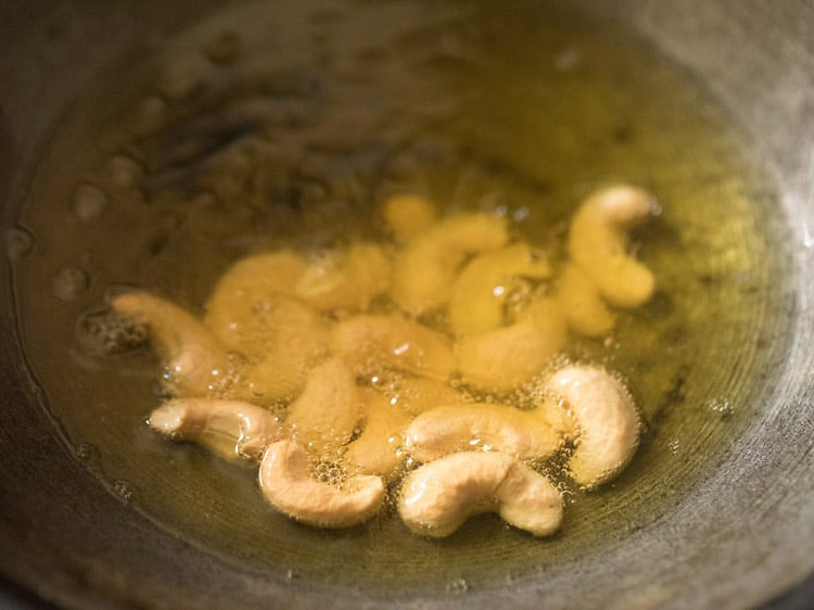 frying cashews for rava kesari recipe.